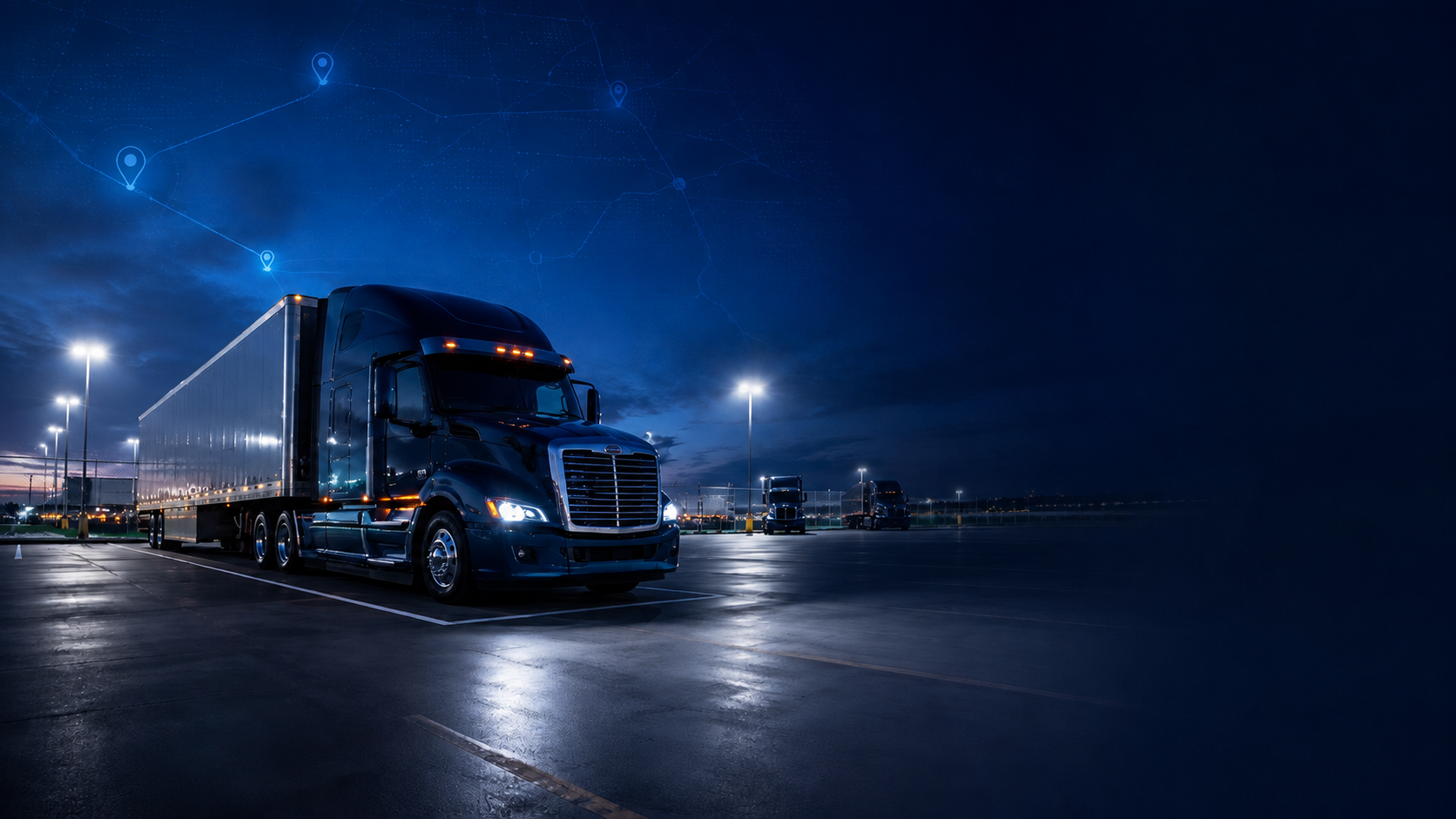 Semi-truck parked in a secure, well-lit lot at night with digital route markers overhead